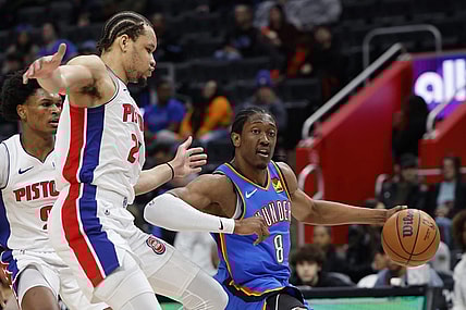 Jan 28, 2024; Detroit, Michigan, USA; Oklahoma City Thunder forward Jalen Williams (8) dribbles on Detroit Pistons forward Kevin Knox II (24) in the first half at Little Caesars Arena. Mandatory Credit: Rick Osentoski-USA TODAY Sports
