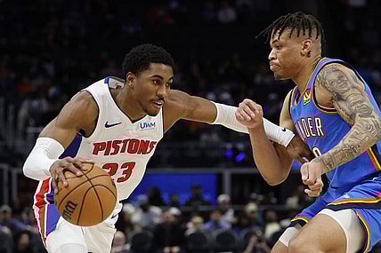Jan 28, 2024; Detroit, Michigan, USA; Detroit Pistons guard Jaden Ivey (23) dribbles defended by Oklahoma City Thunder forward Keyontae Johnson (18) in the second half at Little Caesars Arena. Mandatory Credit: Rick Osentoski-USA TODAY Sports