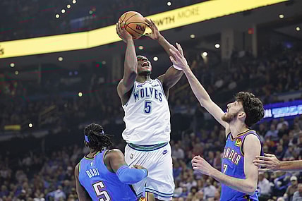 Jan 29, 2024; Oklahoma City, Oklahoma, USA; Minnesota Timberwolves guard Anthony Edwards (5) shoots as Oklahoma City Thunder forward Chet Holmgren (7) defends during the first quarter at Paycom Center. Mandatory Credit: Alonzo Adams-USA TODAY Sports