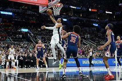 Jan 29, 2024; San Antonio, Texas, USA;  San Antonio Spurs forward Keldon Johnson (3) goes up for a shot in front of Washington Wizards forward Marvin Bagley III (35) in the first half at Frost Bank Center. Mandatory Credit: Daniel Dunn-USA TODAY Sports