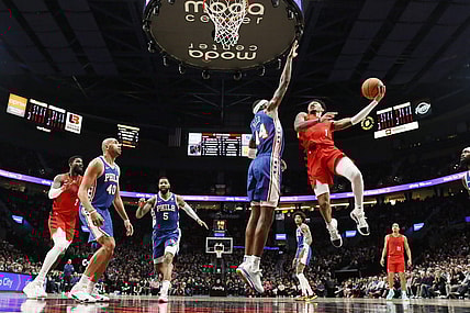 Jan 29, 2024; Portland, Oregon, USA; Portland Trail Blazers shooting guard Anfernee Simons (1) shoots the ball over Philadelphia 76ers small forward Paul Reed (44) during the first half at Moda Center. Mandatory Credit: Soobum Im-USA TODAY Sports
