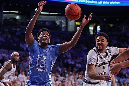 Jan 30, 2024; Atlanta, Georgia, USA; North Carolina Tar Heels forward Jalen Washington (13) and Georgia Tech Yellow Jackets guard Kyle Sturdivant (1) reach for a rebound in the first half at McCamish Pavilion. Mandatory Credit: Brett Davis-USA TODAY Sports