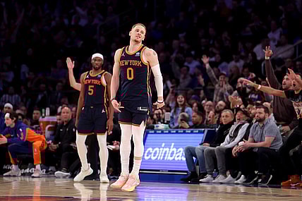 Jan 30, 2024; New York, New York, USA; New York Knicks guard Donte DiVincenzo (0) celebrates his three point shot against the Utah Jazz during the third quarter at Madison Square Garden. Mandatory Credit: Brad Penner-USA TODAY Sports