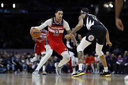 Jan 31, 2024; Washington, District of Columbia, USA; Washington Wizards forward Kyle Kuzma (33) drives to the basket as LA Clippers guard Brandon Boston Jr. (4) defends in the first half at Capital One Arena. Mandatory Credit: Geoff Burke-USA TODAY Sports