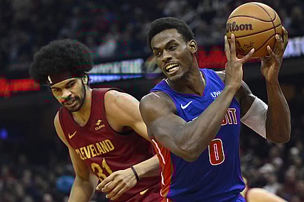 Jan 31, 2024; Cleveland, Ohio, USA; Detroit Pistons center Jalen Duren (0) controls the ball beside Cleveland Cavaliers center Jarrett Allen (31) in the second quarter at Rocket Mortgage FieldHouse. Mandatory Credit: David Richard-USA TODAY Sports