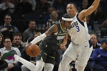 Jan 31, 2024; Minneapolis, Minnesota, USA; Minnesota Timberwolves forward Jaden McDaniels (3) works around Dallas Mavericks forward Grant Williams (3) in the first quarter at Target Center. Mandatory Credit: Bruce Kluckhohn-USA TODAY Sports