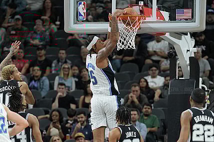 Jan 31, 2024; San Antonio, Texas, USA;  Orlando Magic forward Paolo Banchero (5) dunks in the first half against the San Antonio Spurs at Frost Bank Center. Mandatory Credit: Daniel Dunn-USA TODAY Sports