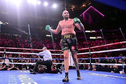 Oct 9, 2021; Las Vegas, Nevada, USA; Deontay Wilder (red/black trunks) is knocked out by Tyson Fury (black/gold trunks) during their WBC/Lineal heavyweight championship boxing match at T-Mobile Arena. Mandatory Credit: Joe Camporeale-USA TODAY Sports