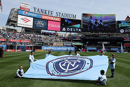 May 1, 2022; New York, New York, USA; Young fans hold a New York City FC banner on the pitch before the game against the San Jose Earthquakes at Yankee Stadium. Mandatory Credit: Vincent Carchietta-USA TODAY Sports