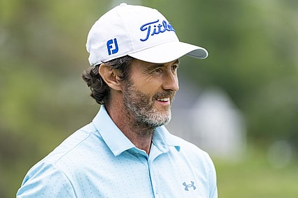 May 26, 2022; Benton Harbor, Michigan, USA; Mark Hensby smiles on the 18th green during the first round of the 2022 KitchenAid Senior PGA Championship at Harbor Shores. Mandatory Credit: Raj Mehta-USA TODAY Sports