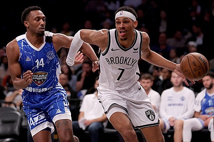 Oct 12, 2023; Brooklyn, NY, USA; Brooklyn Nets forward Darius Bazley (7) drives to the basket against Maccabi Ra'anana guard Dakarai Tucker (14) during the fourth quarter at Barclays Center. Mandatory Credit: Brad Penner-USA TODAY Sports