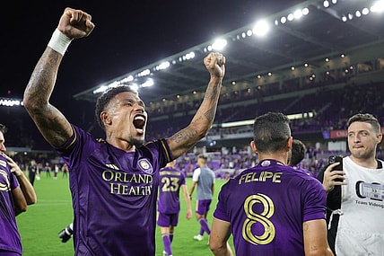 Oct 30, 2023; Orlando, Florida, USA; Orlando City midfielder Junior Urso (21) signals to fans after defeating the Nashville SC of game one in a round one match of the 2023 MLS Cup Playoffs at Exploria Stadium. Mandatory Credit: Nathan Ray Seebeck-USA TODAY Sports
