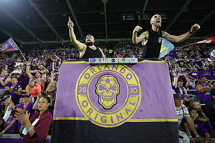 Oct 30, 2023; Orlando, Florida, USA; Orlando City fans celebrate after defeating the Nashville SC of game one in a round one match of the 2023 MLS Cup Playoffs at Exploria Stadium. Mandatory Credit: Nathan Ray Seebeck-USA TODAY Sports