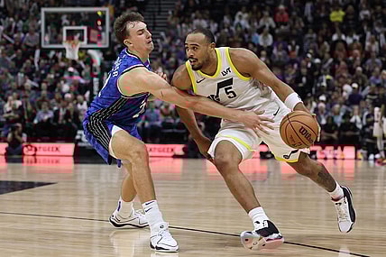 Nov 2, 2023; Salt Lake City, Utah, USA; Utah Jazz guard Talen Horton-Tucker (5) drives against Orlando Magic forward Franz Wagner (22) in the fourth quarter at the Delta Center. Mandatory Credit: Rob Gray-USA TODAY Sports