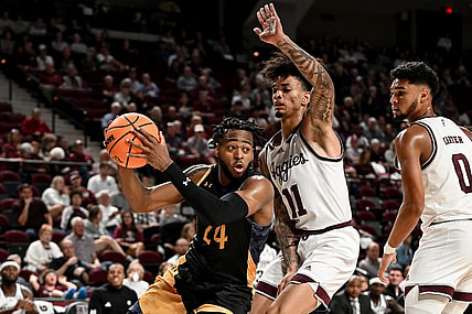 Nov 6, 2023; College Station, Texas, USA; Texas A&M Commerce forward Jerome Brewer Jr. (24) controls the ball as Texas A&M Aggies forward Andersson Garcia (11) defends during the first half at Reed Arena. Mandatory Credit: Maria Lysaker-USA TODAY Sports