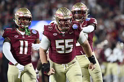 Dec 2, 2023; Charlotte, NC, USA; Florida State Seminoles defensive lineman Braden Fiske (55) reacts after a tackle on Louisville Cardinals running back Jawhar Jordan (25) in the first quarter at Bank of America Stadium. Mandatory Credit: Bob Donnan-USA TODAY Sports