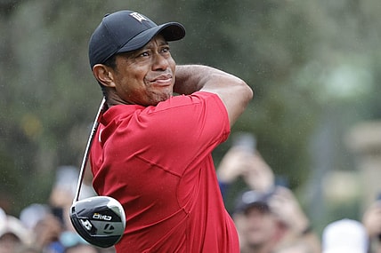 Dec 17, 2023; Orlando, Florida, USA;  Tiger Woods plays his shot from the first tee during the PNC Championship at The Ritz-Carlton Golf Club. Mandatory Credit: Reinhold Matay-USA TODAY Sports