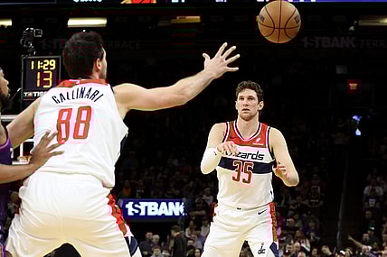 Dec 17, 2023; Phoenix, Arizona, USA; Washington Wizards center Mike Muscala (35) makes a pass to Washington Wizards forward Danilo Gallinari (88) against the Phoenix Suns during the first half at Footprint Center. Mandatory Credit: Zachary BonDurant-USA TODAY Sports