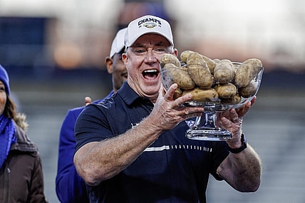 Dec 23, 2023; Boise, ID, USA; Georgia State Panthers head coach Shawn Elliott hoists the Famous Idaho Potato Bowl trophy after the game against the Utah State Aggies at Albertsons Stadium. Georgia State defeats Utah State 45-22. Mandatory Credit: Brian Losness-USA TODAY Sports