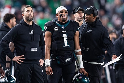 Dec 25, 2023; Philadelphia, Pennsylvania, USA; Philadelphia Eagles head coach Nick Sirianni (L) and quarterback Jalen Hurts (1) and offensive coordinator Brian Johnson (R) talk during the second quarter against the New York Giants at Lincoln Financial Field. Mandatory Credit: Bill Streicher-USA TODAY Sports