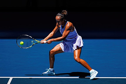 Jan 14, 2024; Melbourne, Victoria, Australia;  Leylah Fernandez of Canada hits a shot against Sarah Bejlek of the Czech Republic in the first round of the women s singles. Mandatory Credit: Mike Frey-USA TODAY Sports