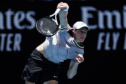 Jan 14, 2024; Melbourne, Victoria, Australia;   Jannik Sinner of Italy hits a shot against Botic Van De Zandschulp of the Netherlands in the first round of the men s singles. Mandatory Credit: Mike Frey-USA TODAY Sports