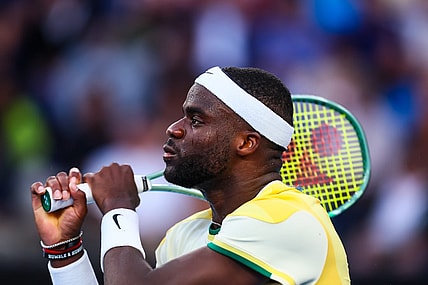 Jan 17, 2024; Melbourne, Victoria, Australia; Frances Tiafoe of the United States plays a shot against Tomas Machac (not pictured) of Czechia in Round 2 of the Men's Singles on Day 4 of the Australian Open tennis at Kia Arena. Mandatory Credit: Mike Frey-USA TODAY Sports