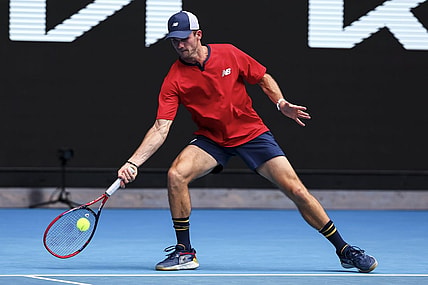 Jan 20, 2024; Melbourne, Victoria, Australia; Tommy Paul of the United States plays a shot against Miomir Kecmanovic (not pictured) of Serbia in Round 3 of the Men's Singles on Day 7 of the Australian Open tennis at Margaret Court Arena. Mandatory Credit: Mike Frey-USA TODAY Sports