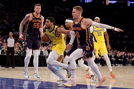 Feb 1, 2024; New York, New York, USA; Indiana Pacers guard Tyrese Haliburton (0) drives to the basket against New York Knicks center Isaiah Hartenstein (55) and guards Josh Hart (3) and Donte DiVincenzo (0) during the first quarter at Madison Square Garden. Mandatory Credit: Brad Penner-USA TODAY Sports