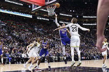 Feb 1, 2024; Salt Lake City, Utah, USA; Philadelphia 76ers forward Tobias Harris (12) lays the ball up against Utah Jazz forward Lauri Markkanen (23) during the first quarter at Delta Center. Mandatory Credit: Rob Gray-USA TODAY Sports