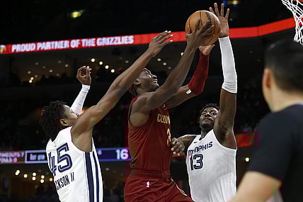 Feb 1, 2024; Memphis, Tennessee, USA; Cleveland Cavaliers guard Caris LeVert (3) drives to the basket between Memphis Grizzlies forward GG Jackson (45) and forward-center Jaren Jackson Jr. (13) during the first half at FedExForum. Mandatory Credit: Petre Thomas-USA TODAY Sports