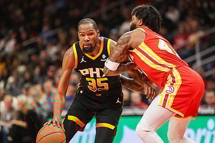 Feb 2, 2024; Atlanta, Georgia, USA; Phoenix Suns forward Kevin Durant (35) drives on Atlanta Hawks forward Saddiq Bey (41) in the first quarter at State Farm Arena. Mandatory Credit: Brett Davis-USA TODAY Sports