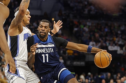 Feb 2, 2024; Minneapolis, Minnesota, USA; Minnesota Timberwolves center Naz Reid (11) works around Orlando Magic forward Paolo Banchero (5) in the first quarter at Target Center. Mandatory Credit: Bruce Kluckhohn-USA TODAY Sports