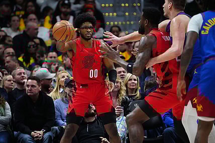 Feb 2, 2024; Denver, Colorado, USA; Portland Trail Blazers guard Scoot Henderson (00) passes the ball in the first half against the Denver Nuggets at Ball Arena. Mandatory Credit: Ron Chenoy-USA TODAY Sports