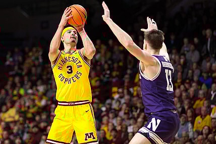 Feb 3, 2024; Minneapolis, Minnesota, USA; Minnesota Golden Gophers forward Dawson Garcia (3) shoots as Northwestern Wildcats guard Brooks Barnhizer (13) defends during the first half at Williams Arena. Mandatory Credit: Matt Krohn-USA TODAY Sports