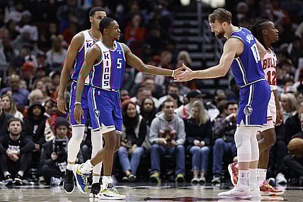 Feb 3, 2024; Chicago, Illinois, USA; Sacramento Kings guard De'Aaron Fox (5) celebrates with forward Domantas Sabonis (10) after scoring against the Chicago Bulls during the first half at United Center. Mandatory Credit: Kamil Krzaczynski-USA TODAY Sports
