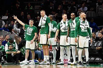 Feb 4, 2024; Boston, Massachusetts, USA; the Celtics bench reacts after a score against the Memphis Grizzlies during the second half at TD Garden. Mandatory Credit: Eric Canha-USA TODAY Sports