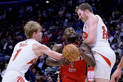 Feb 5, 2024; New Orleans, Louisiana, USA; Toronto Raptors guard Gradey Dick (1) and Toronto Raptors center Jakob Poeltl (19) double team New Orleans Pelicans forward Zion Williamson (1) during the first half at Smoothie King Center. Mandatory Credit: Matthew Hinton-USA TODAY Sports