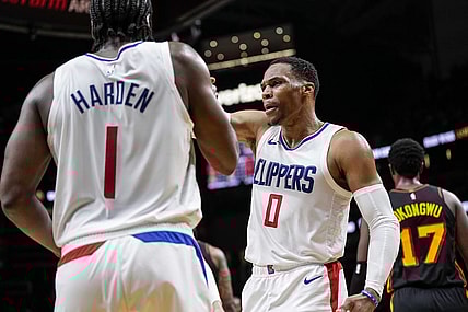 Feb 5, 2024; Atlanta, Georgia, USA; LA Clippers guard Russell Westbrook (0) reacts with guard James Harden (1) against the Atlanta Hawks during the second half at State Farm Arena. Mandatory Credit: Dale Zanine-USA TODAY Sports