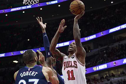 Feb 6, 2024; Chicago, Illinois, USA; Minnesota Timberwolves center Rudy Gobert (27) defends Chicago Bulls forward DeMar DeRozan (11) during the first quarter at United Center. Mandatory Credit: David Banks-USA TODAY Sports