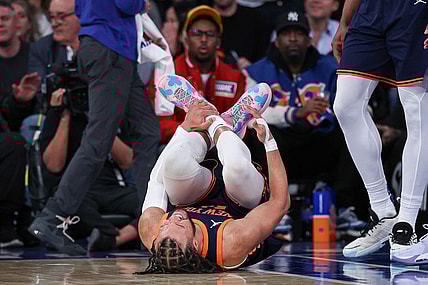 Feb 6, 2024; New York, New York, USA; New York Knicks guard Jalen Brunson (11) reacts after being injured during the second half against the Memphis Grizzlies at Madison Square Garden. Mandatory Credit: Vincent Carchietta-USA TODAY Sports