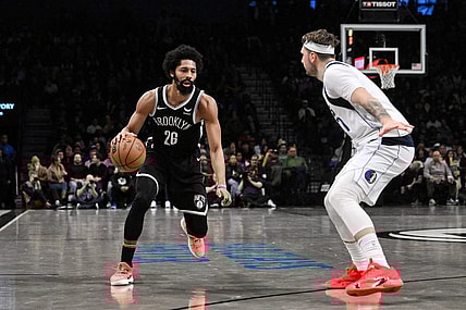 Feb 6, 2024; Brooklyn, New York, USA; Brooklyn Nets guard Spencer Dinwiddie (26) makes a move against Dallas Mavericks guard Luka Doncic (77) during the fourth quarter at Barclays Center. Mandatory Credit: John Jones-USA TODAY Sports