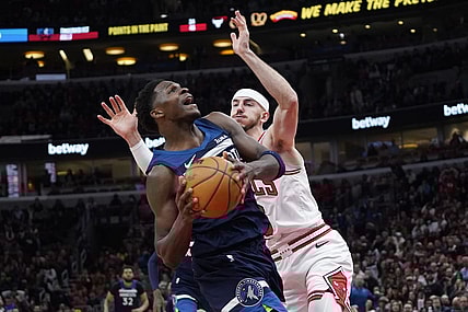 Feb 6, 2024; Chicago, Illinois, USA; Chicago Bulls guard Alex Caruso (6) defends Minnesota Timberwolves guard Anthony Edwards (5) during the second half at United Center. Mandatory Credit: David Banks-USA TODAY Sports