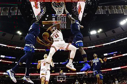 Feb 6, 2024; Chicago, Illinois, USA; Chicago Bulls forward DeMar DeRozan (11) is defended by Minnesota Timberwolves guard Anthony Edwards (5) during the second half at United Center. Mandatory Credit: David Banks-USA TODAY Sports