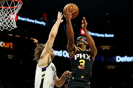 Feb 6, 2024; Phoenix, Arizona, USA; Phoenix Suns guard Bradley Beal (3) shoots the ball against Milwaukee Bucks center Robin Lopez (42) during the third quarter at Footprint Center. Mandatory Credit: Mark J. Rebilas-USA TODAY Sports