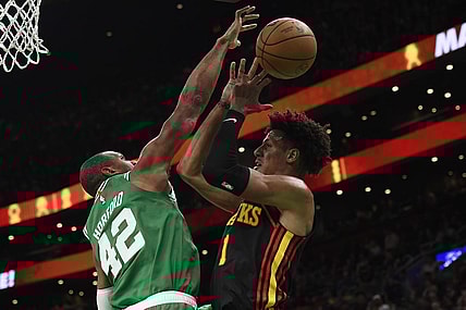 Feb 7, 2024; Boston, Massachusetts, USA;  Boston Celtics center Al Horford (42) blocks the shot of Atlanta Hawks forward Jalen Johnson (1) during the first half at TD Garden. Mandatory Credit: Bob DeChiara-USA TODAY Sports