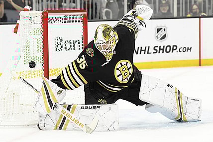 Feb 8, 2024; Boston, Massachusetts, USA; Boston Bruins goaltender Linus Ullmark (35) makes a save during the second period against the Vancouver Canucks at TD Garden. Mandatory Credit: Bob DeChiara-USA TODAY Sports