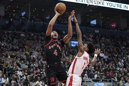 Feb 9, 2024; Toronto, Ontario, CAN; Toronto Raptors forward Scottie Barnes (4) shoots for a basket against Houston Rockets forward Amen Thompson (1) during the first half at Scotiabank Arena. Mandatory Credit: John E. Sokolowski-USA TODAY Sports