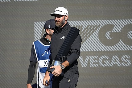 Feb 10, 2024; Las Vegas, Nevada, USA; Dustin Johnson holds the individual championship trophy after winning the LIV Golf Las Vegas tournament at Las Vegas Country Club. Mandatory Credit: Lucas Peltier-USA TODAY Sports