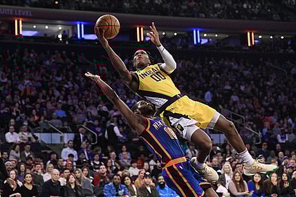 Feb 10, 2024; New York, New York, USA; Indiana Pacers guard Bennedict Mathurin (00) shoots the ball while being defended by New York Knicks guard Alec Burks (18) during the second quarter at Madison Square Garden. Mandatory Credit: John Jones-USA TODAY Sports